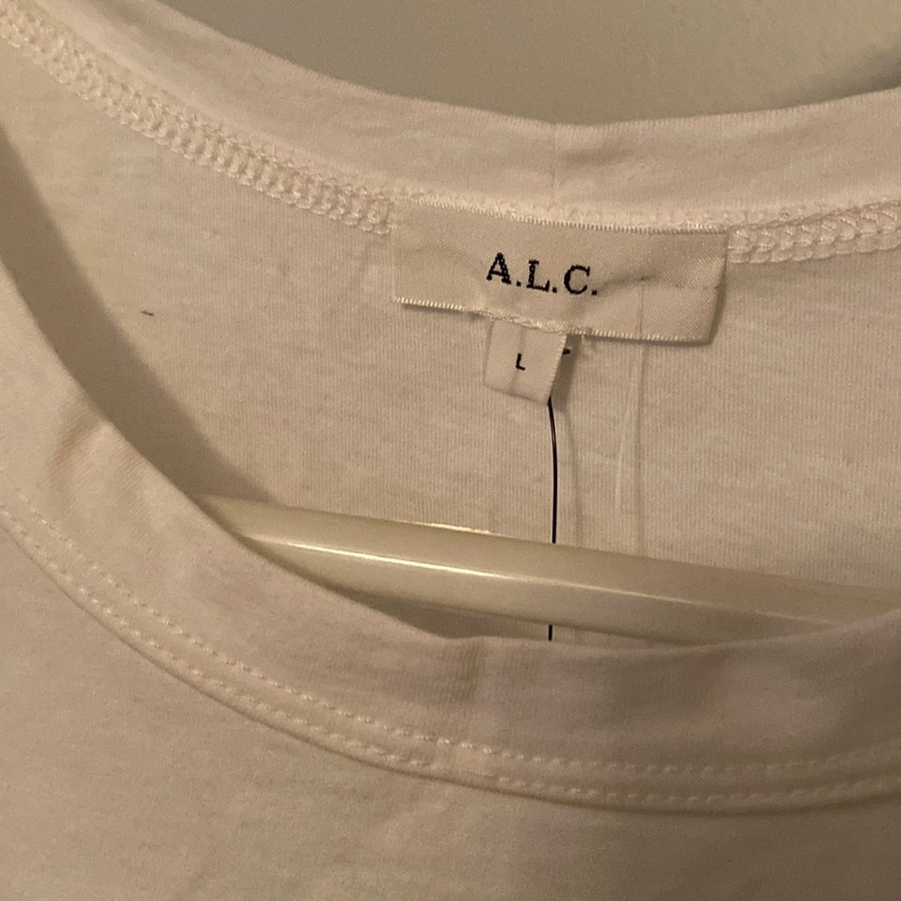 Got two of the same shirt and ended up keeping the Medium. Never worn, NWT.